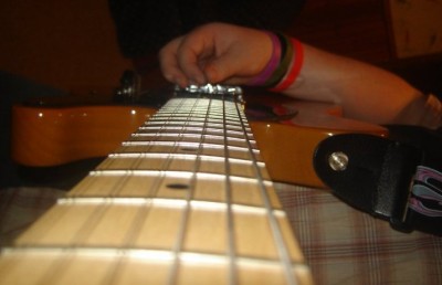 a picture my friend took of me playing either crazy train or Dee, although i think it's crazy train because i'm using a pick.